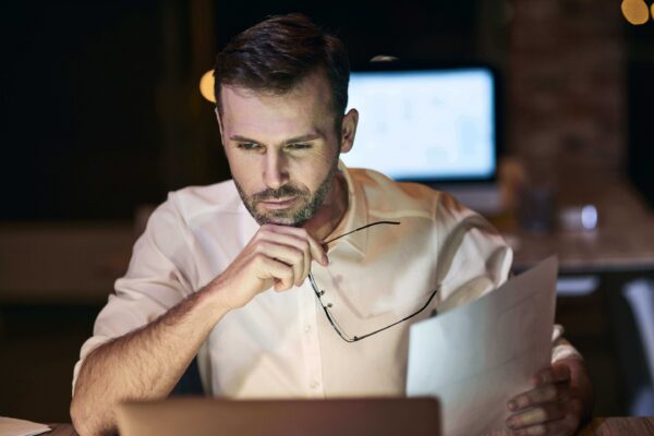 focused man working late his home office